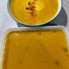 Roasted Kabocha Squash Soup (vegan & gf) shown with greek natural yogurt and a sprinkle of chilli & cayenne pepper