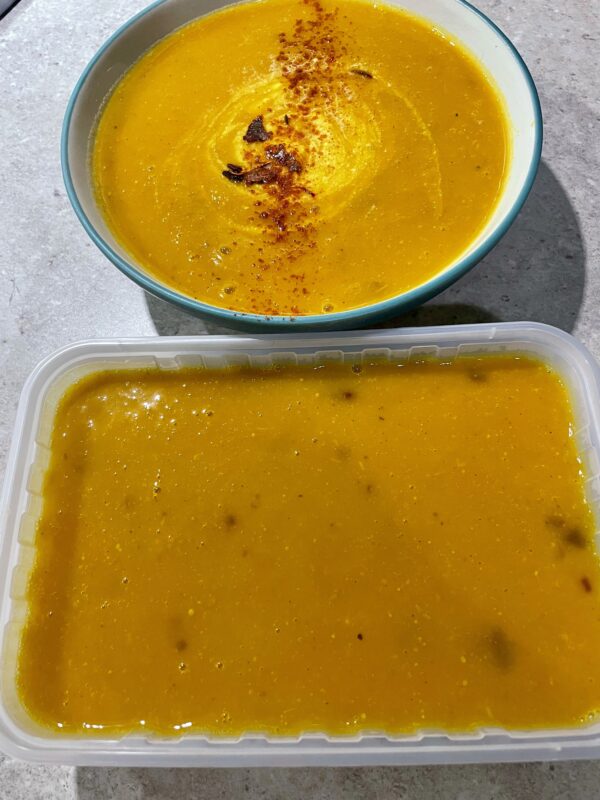 Roasted Kabocha Squash Soup (vegan & gf) shown with greek natural yogurt and a sprinkle of chilli & cayenne pepper
