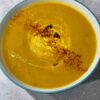 Roasted Kabocha Squash Soup (vegan & gf) shown with greek natural yogurt and a sprinkle of chilli & cayenne pepper